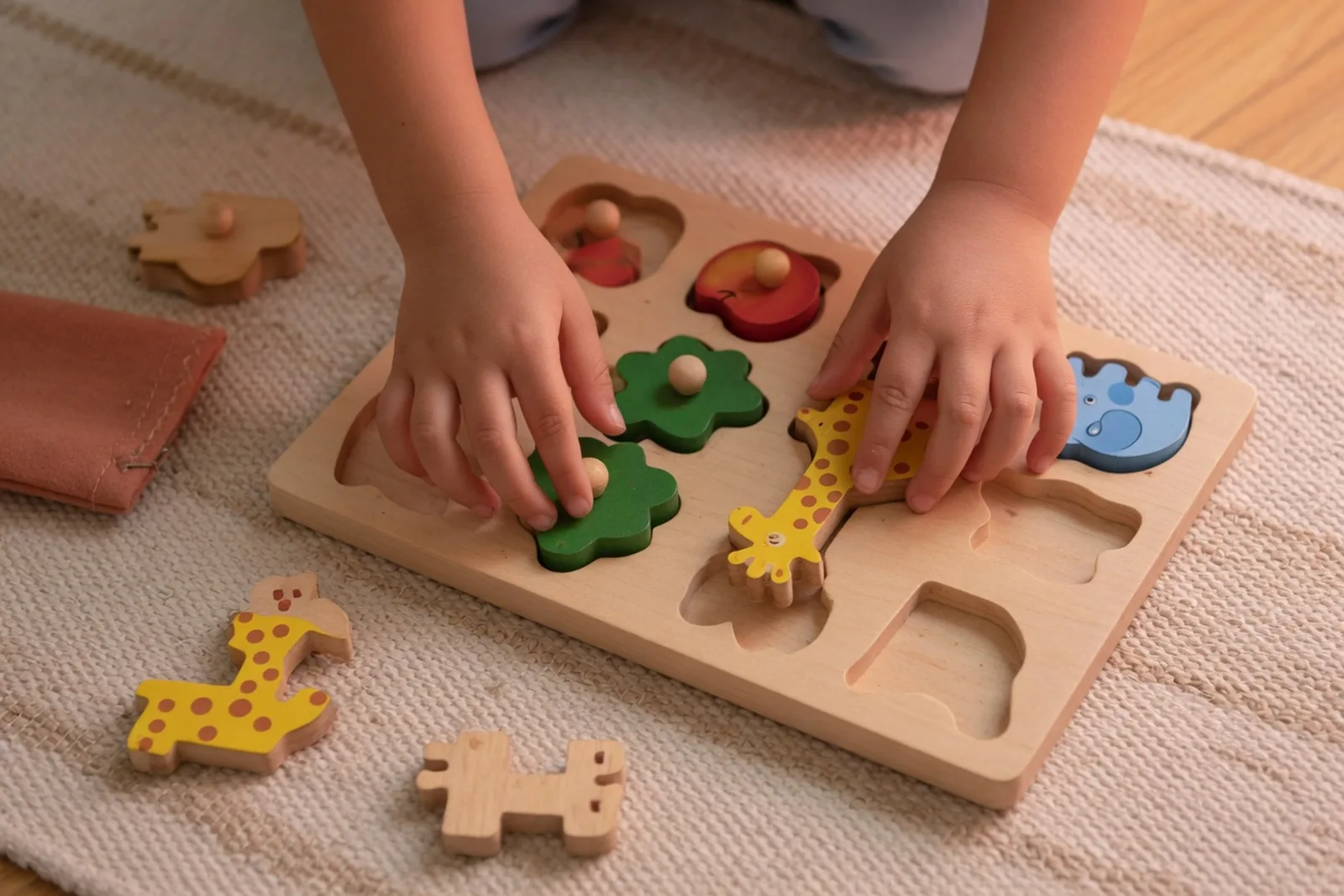 Child organizing materials for independent classroom work
